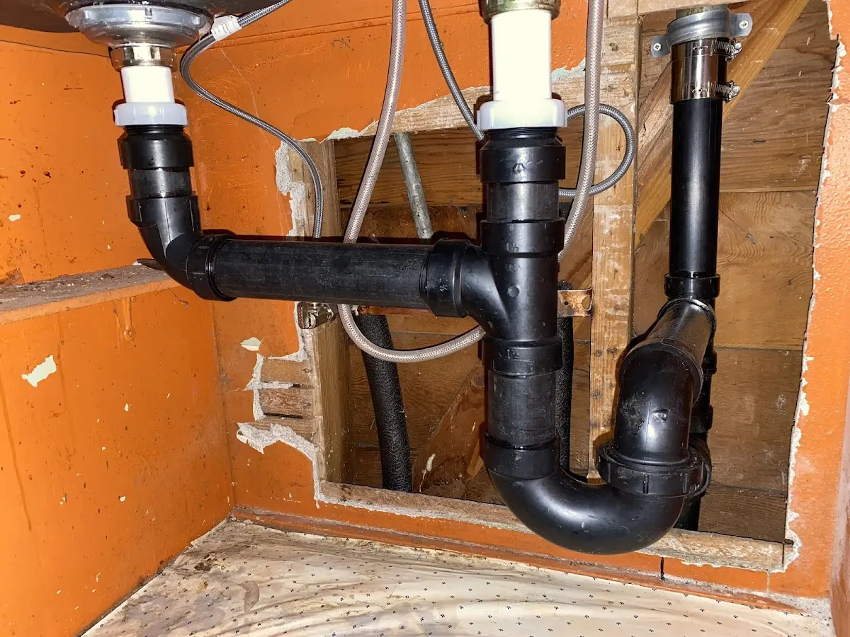 Professional Garbage Disposal Repair equipment and tools on the job in Belmont